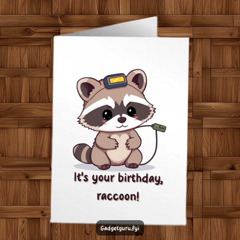 Funny free printable birthday card: a tiny raccoon in a headlamp looks intently at a tiny wire, ready for birthday surprises.