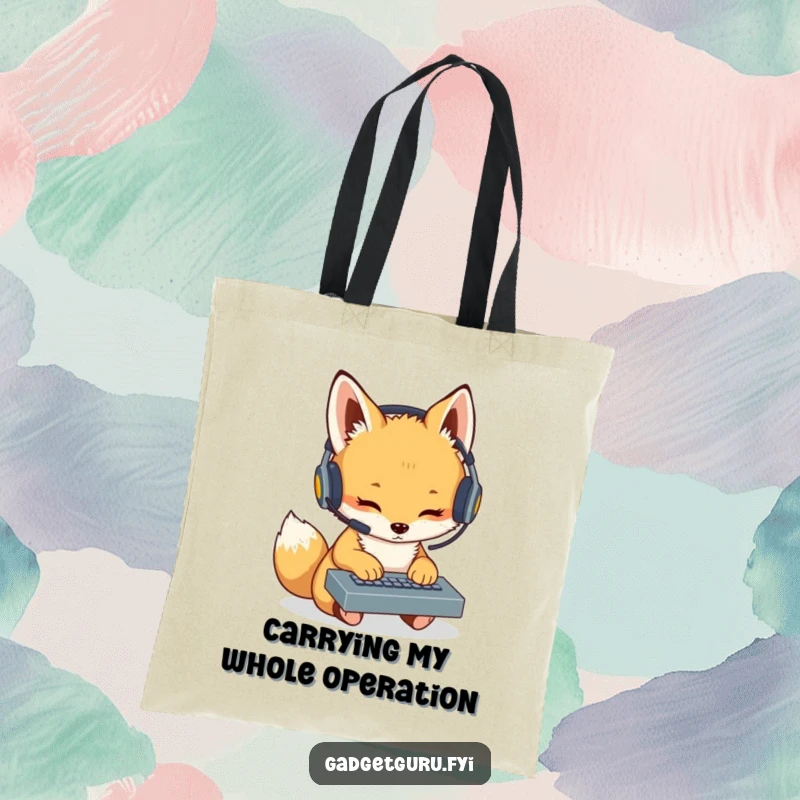 Funny Fox Cub Coder Tote Bag: A humorous tote featuring a fox cub with a headset typing on a miniature keyboard, ideal for carrying tech essentials.